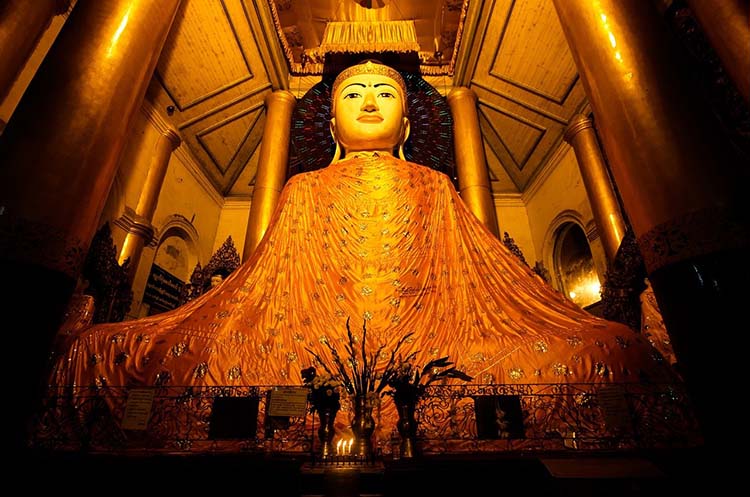 A large image of the Buddha in one of the buildings of the Shwedagon pagoda complex