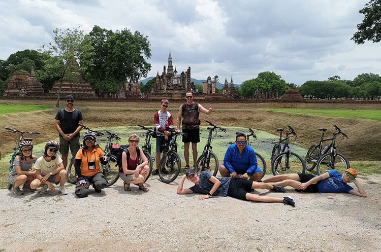 Cyclists taking a break in the Sukhothai Historical Park