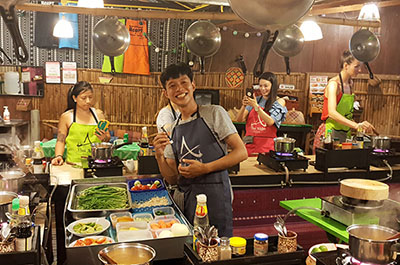 Students preparing food at their cooking stations