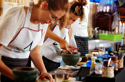 Students preparing curry paste