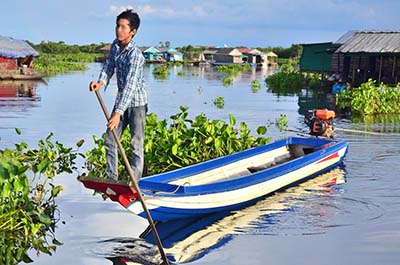 A fisherman on his boat at Tonlé Sap Lake