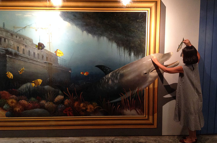 Interacting with a painting at the Trick Art Museum in Hua Hin