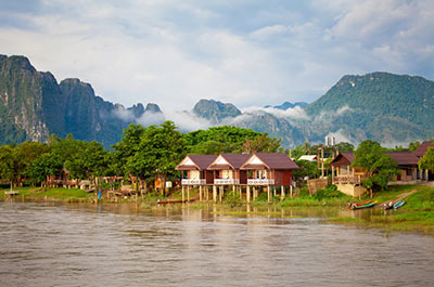 The Nam Song river with karst mountains in the background