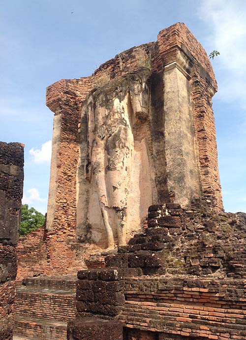 Very large standing Buddha image in the mandapa of the Wat Chetuphon