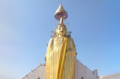 Standing Buddha at Wat Intharawihan