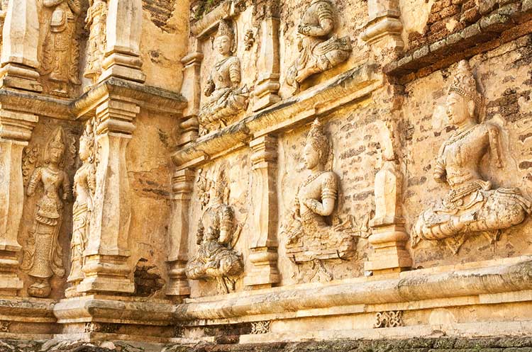 Thewada sculptings on the wall of the viharn at Wat Jed Yod in Chiang Mai