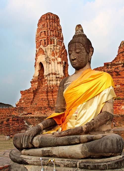 Seated Buddha and a Khmer style prang