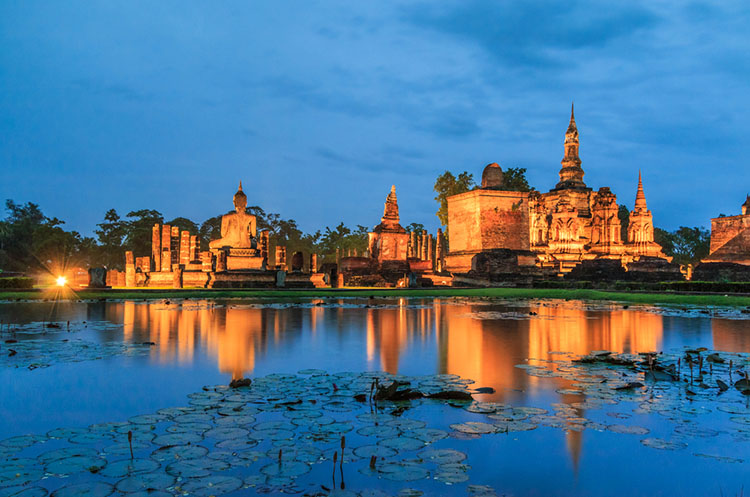 The Wat Mahathat in the Central Zone of the Sukhothai Historical Park at dusk