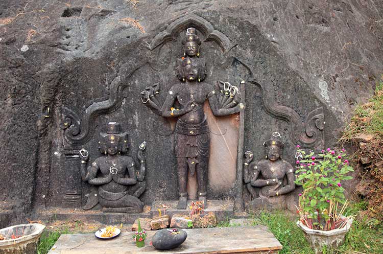 Hindu depections carved in a rock at Wat Phou