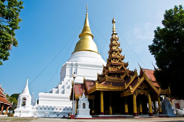 Chedi and Burmese style mondop at Wat Phra Kaew Don Tao in Lampang