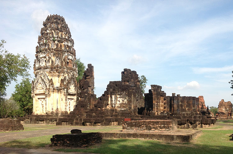 The prang and the remains of the viharn of the Wat Phra Phai Luang Khmer temple