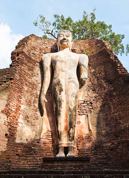 Standing Buddha in the mondop of the Wat Phra Si Iriyabot in Kamphaeng Phet Historical Park