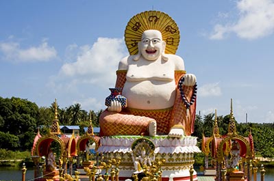 The 30 meter tall statue of a fat, smiling Chinese Buddha at Wat Plai Laem