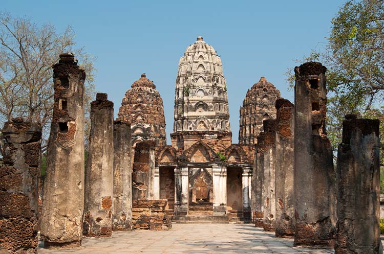 The ruins of a temple with a Khmer style prang in Sukhothai Historical Park