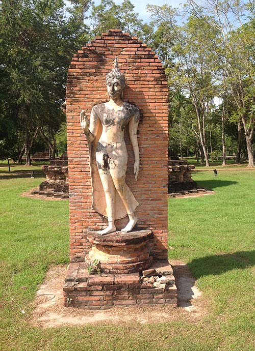 Sukhothai style walking Buddha image at Wat Tra Phang Ngoen