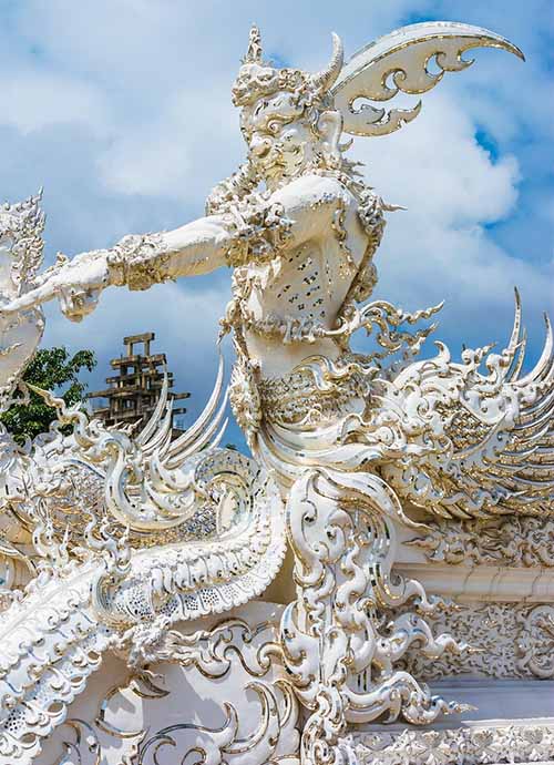 A guardian with a sword guarding the white temple