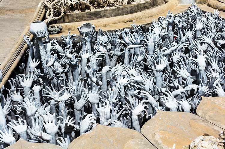 Reaching hands at the White Temple symbolizing desire