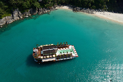 The Yona Beach Club party boat floating on the sea in Phuket